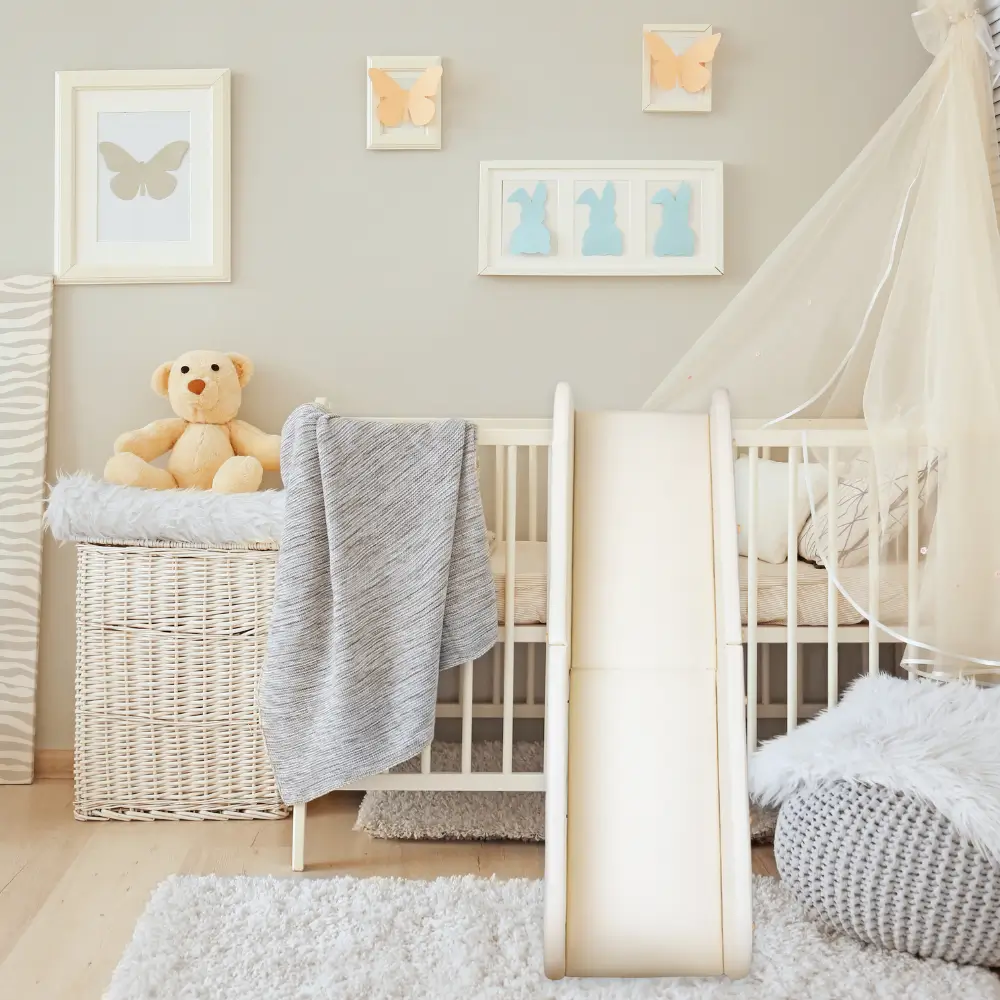 product shot of the crawlaroo doman crawling track propped against baby crib to illustrate it's size