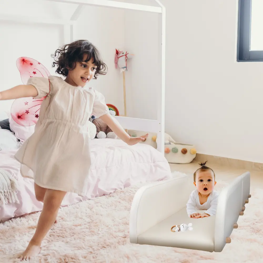 happy baby safely enjoys tummy time in the crawlaroo doman crawling track as older sibling plays running around to illustrate why the crawling track makes tummy time a bit safer for baby
