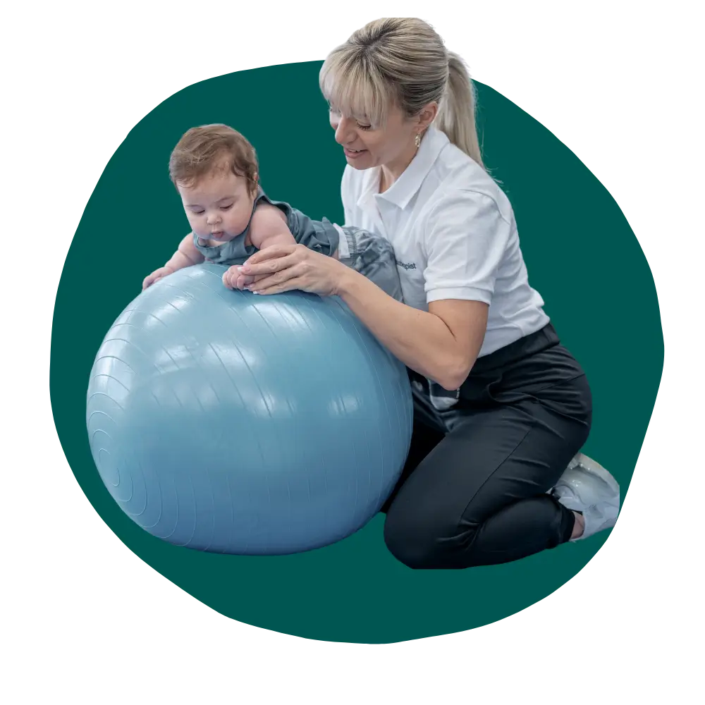 physical therapist baby development expert helping a baby with motor skills delay to learn to crawl faster