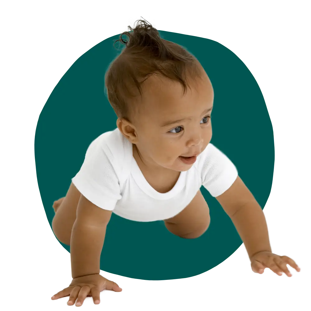 hispanic black baby learning to crawl