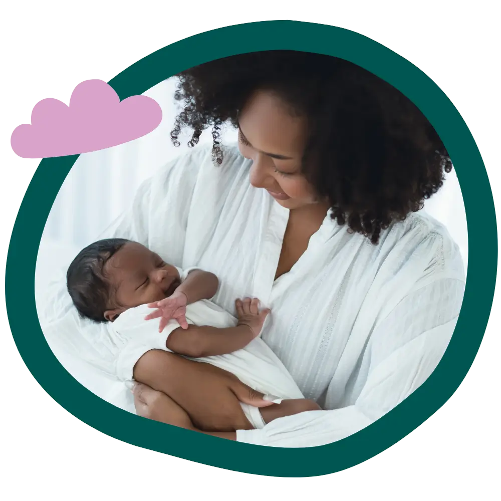 black mother embraces her newborn baby lovingly